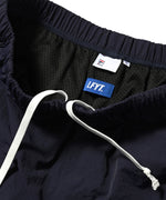 FILA × LFYT - TRACK PANTS LA231203